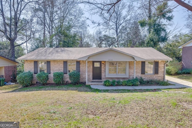 ranch-style home with a front lawn