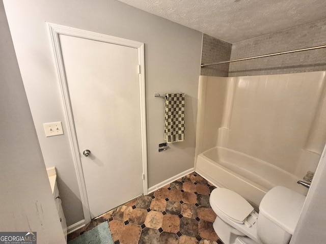 full bathroom featuring shower / tub combination, vanity, a textured ceiling, and toilet