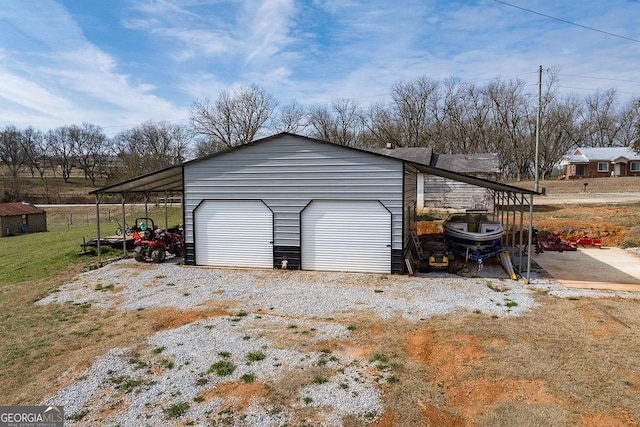 garage featuring a carport