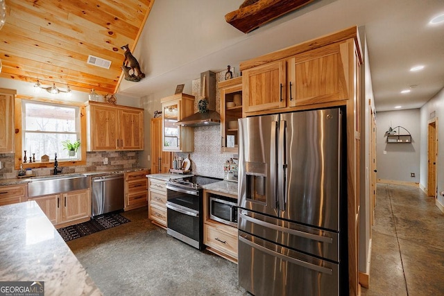 kitchen featuring wall chimney exhaust hood, sink, tasteful backsplash, vaulted ceiling, and stainless steel appliances