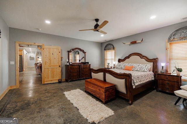 bedroom featuring ceiling fan and stainless steel fridge