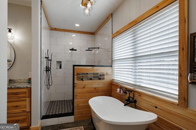 bathroom featuring vanity and shower with separate bathtub