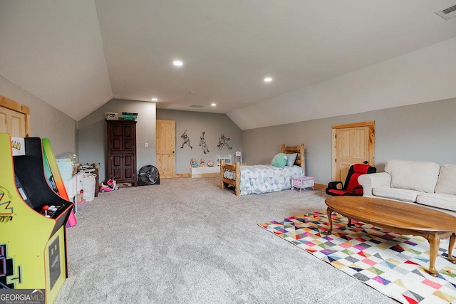 bedroom with lofted ceiling and carpet