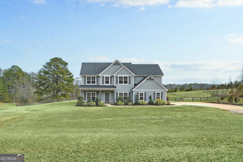 view of front of property with a front lawn