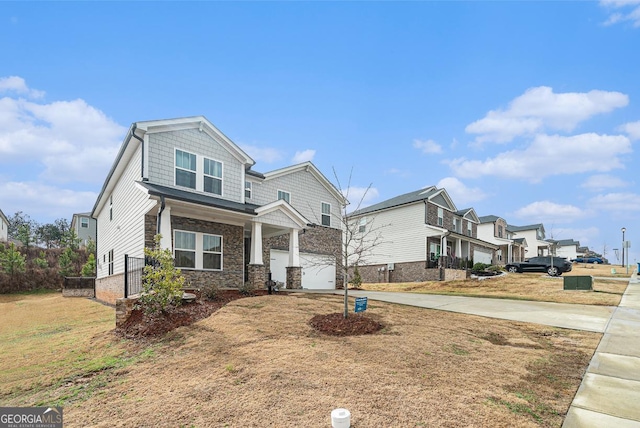 craftsman-style home featuring a garage and a front yard