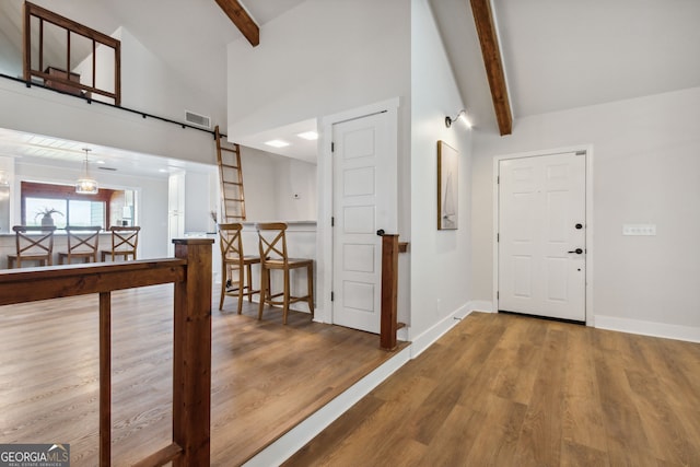 1142 New Point Peter Rd, Saint Marys, GA 31558 - living room with ceiling fan, wood finished floors, beam ceiling, high vaulted ceiling, and baseboards