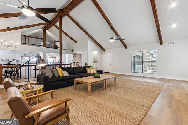 1142 New Point Peter Rd, Saint Marys, GA 31558 - living area featuring a ceiling fan, high vaulted ceiling, a chandelier, beam ceiling, and light wood finished floors