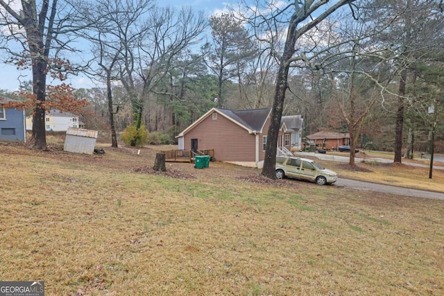 view of yard featuring a wooden deck