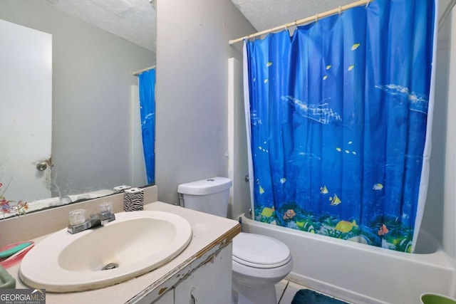 full bathroom featuring shower / bath combination with curtain, vanity, toilet, and a textured ceiling