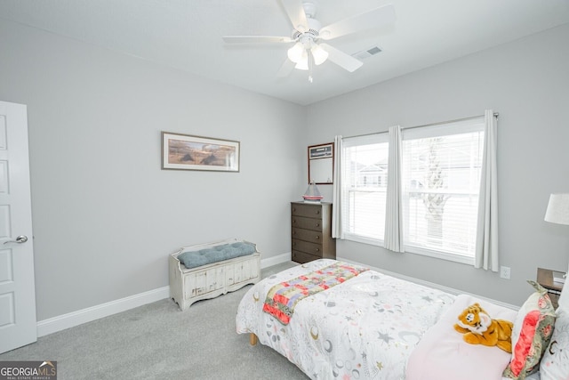 bedroom featuring light colored carpet and ceiling fan