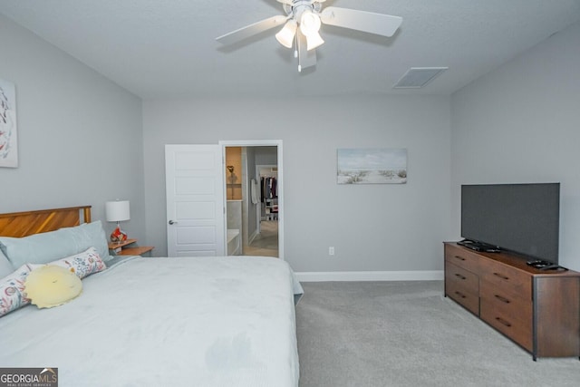 bedroom featuring light colored carpet and ceiling fan