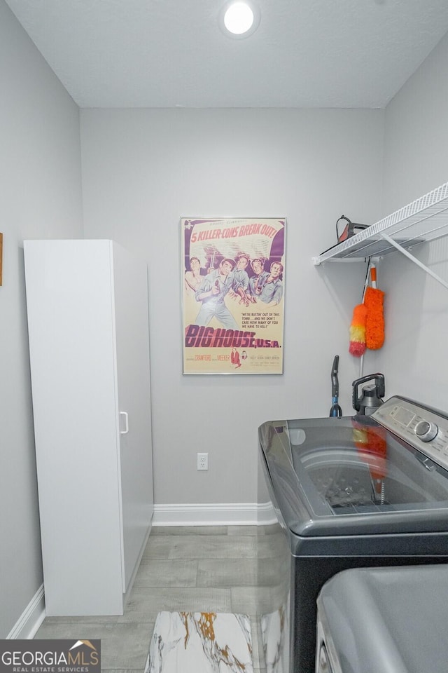 laundry area with separate washer and dryer