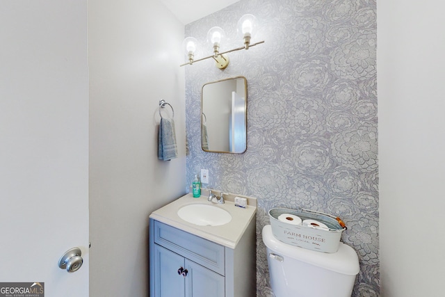 bathroom with vanity and toilet