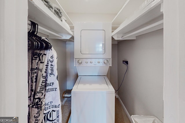 laundry room featuring stacked washer and clothes dryer