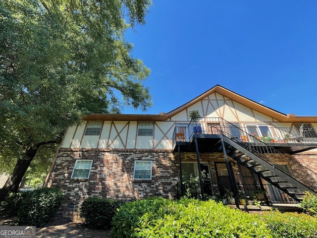 back of property featuring a balcony