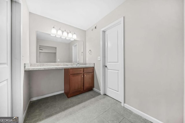 bathroom with vanity and tile patterned flooring