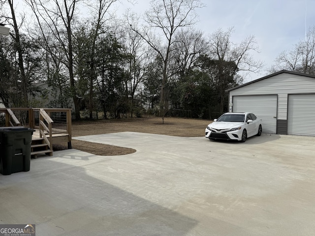 exterior space featuring an outbuilding and a garage