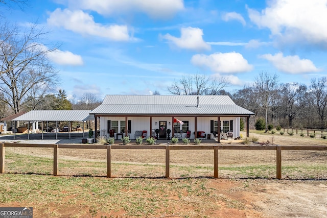 back of house featuring covered porch