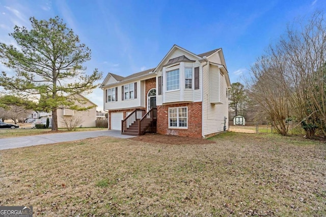 view of front of house featuring a garage and a front yard