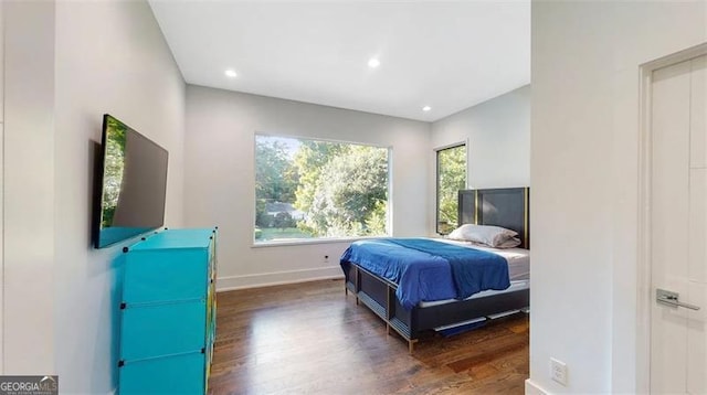 bedroom with recessed lighting, baseboards, and wood finished floors