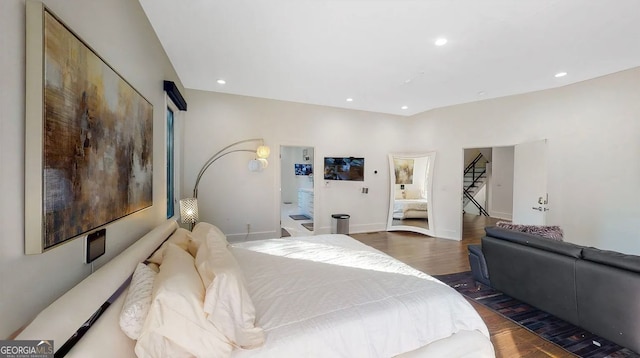 bedroom featuring recessed lighting, baseboards, and wood finished floors