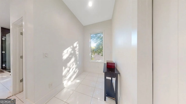 hallway featuring light tile patterned floors