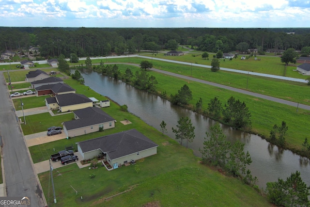 drone / aerial view with a water view