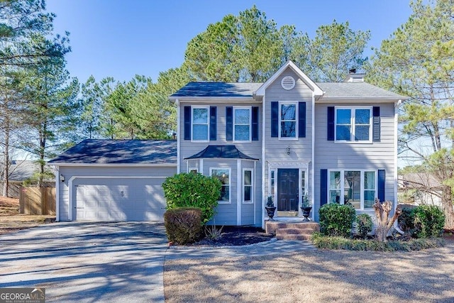 colonial inspired home with a garage