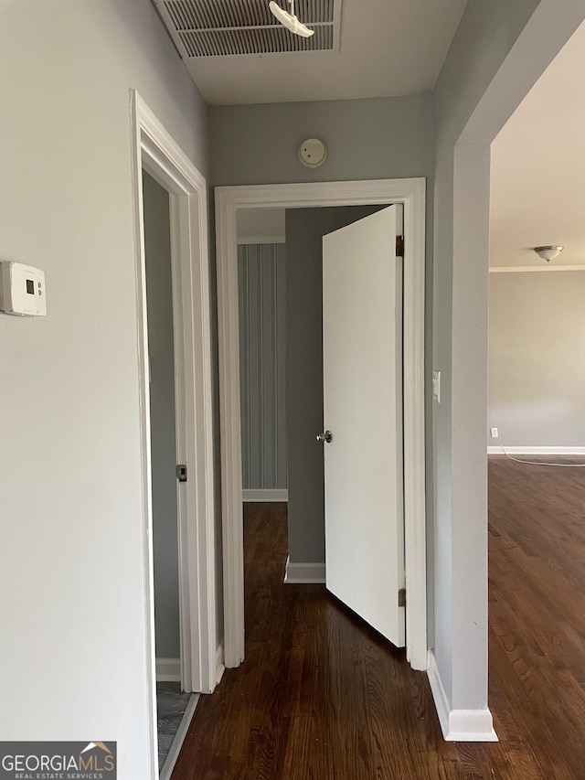 hall with dark hardwood / wood-style floors