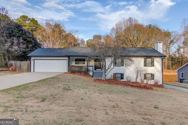 single story home with a garage, concrete driveway, a chimney, and fence