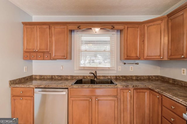 kitchen featuring dark countertops, dishwasher, a textured ceiling, and a sink