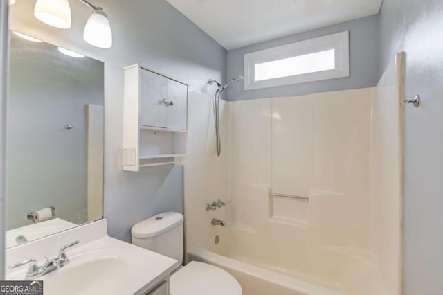 bathroom with  shower combination, vanity, and toilet