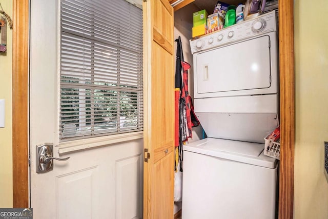 laundry room featuring stacked washer and dryer