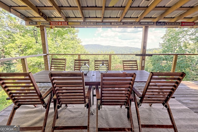 wooden deck with a mountain view