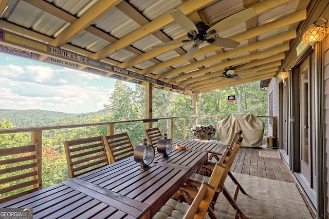 wooden deck with ceiling fan