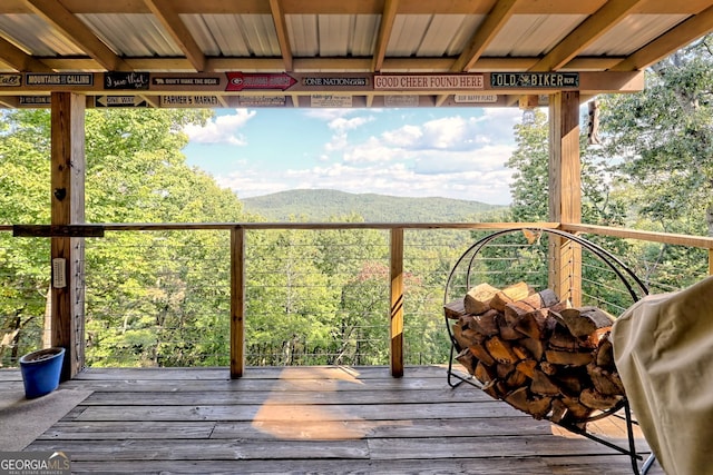 wooden terrace with a mountain view