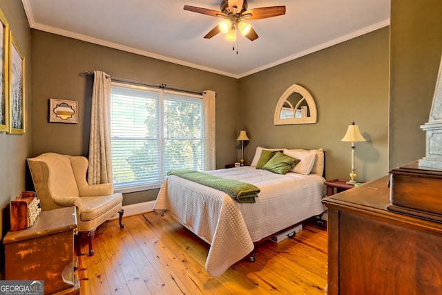 bedroom featuring ceiling fan, ornamental molding, and light wood-type flooring