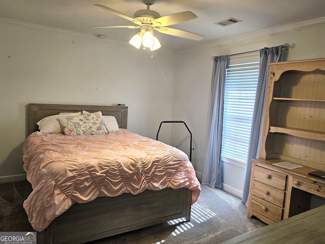 carpeted bedroom featuring multiple windows, crown molding, and ceiling fan