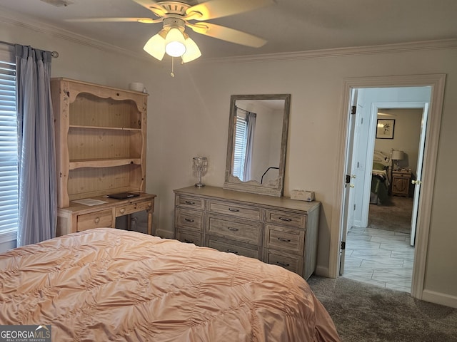 bedroom featuring crown molding, ceiling fan, carpet flooring, and multiple windows