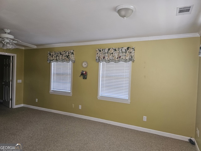 carpeted empty room featuring ceiling fan and ornamental molding