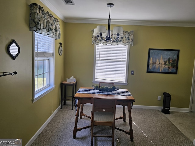 dining space featuring ornamental molding and a chandelier