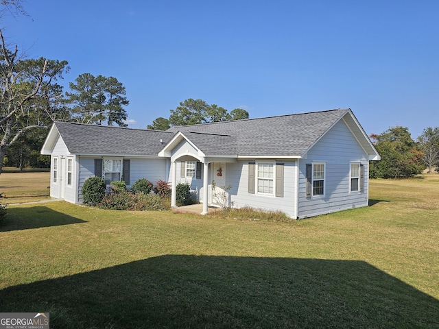 ranch-style home featuring a front yard