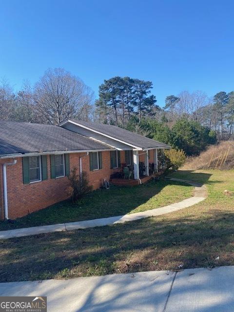 view of home's exterior featuring a lawn