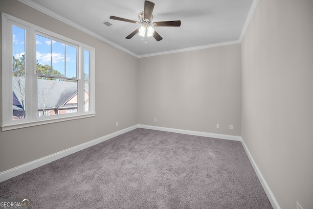 carpeted empty room featuring ornamental molding and ceiling fan