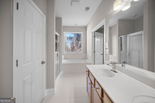 bathroom featuring vanity, tile patterned floors, and separate shower and tub