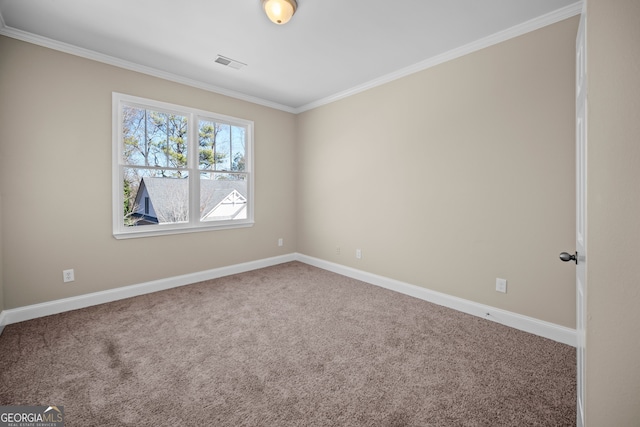 carpeted spare room with crown molding