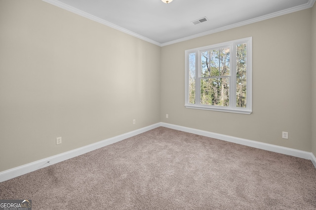 carpeted empty room featuring ornamental molding