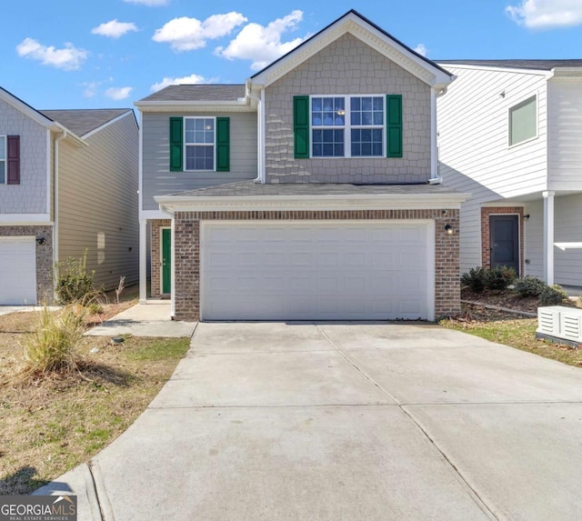 townhome / multi-family property featuring a garage