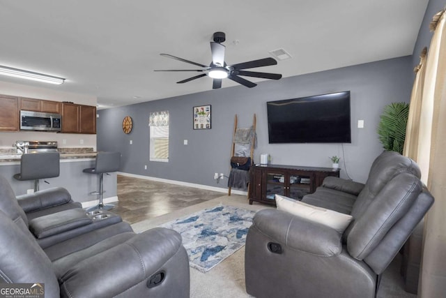 living room with ceiling fan