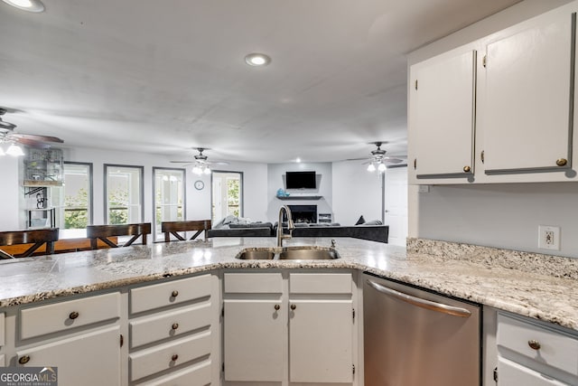 kitchen featuring white cabinetry, sink, kitchen peninsula, and dishwasher